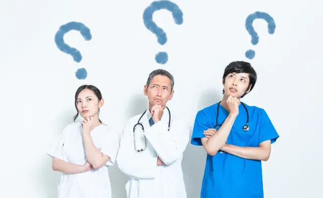 Three medical professionals deep in thought with question marks over their heads